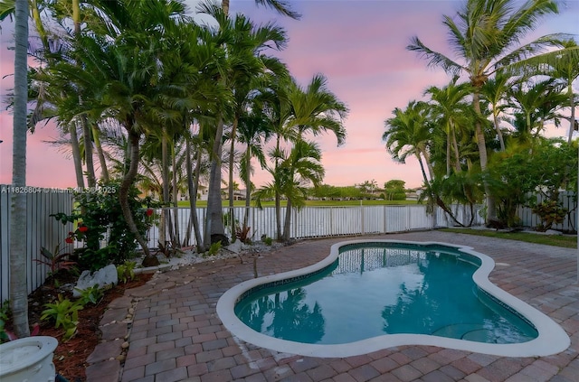 6425 SW 164th Ave, Miami, FL 33193 - pool at dusk featuring a fenced backyard and a patio area