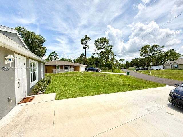 5029 N Dogwood Cir, La Belle, FL 33935 - view of grassy yard with a patio area