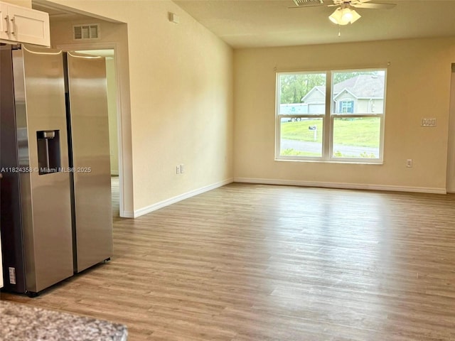 5029 N Dogwood Cir, La Belle, FL 33935 - spare room with ceiling fan and light wood finished floors