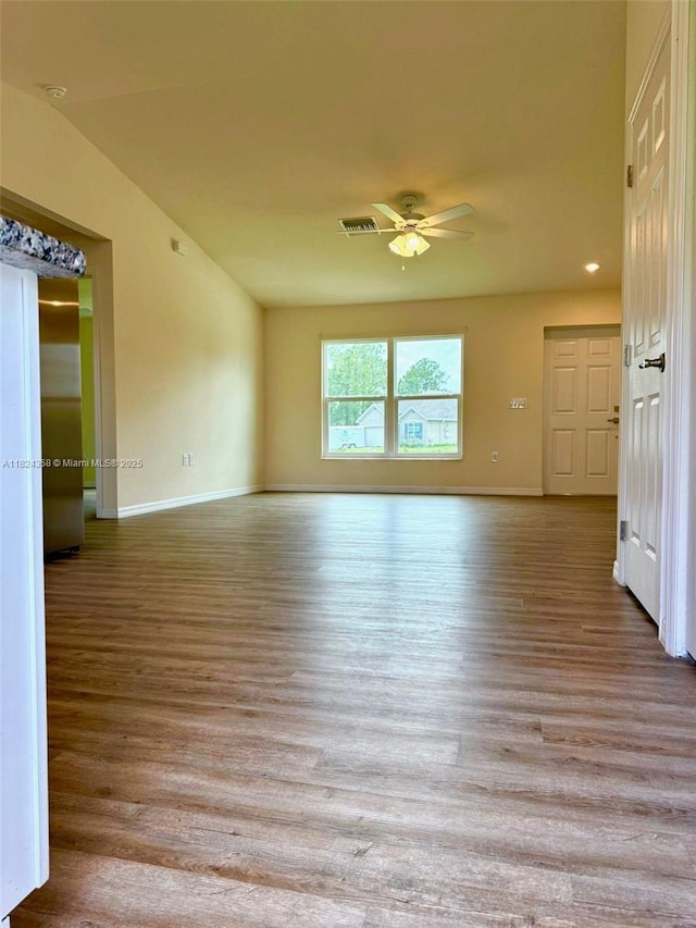 5029 N Dogwood Cir, La Belle, FL 33935 - empty room with a ceiling fan and wood finished floors
