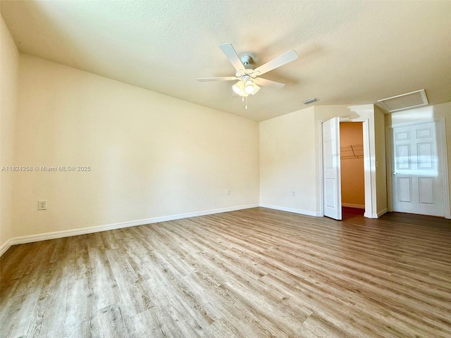 5029 N Dogwood Cir, La Belle, FL 33935 - spare room featuring wood finished floors, a ceiling fan, and a textured ceiling
