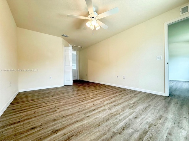 5029 N Dogwood Cir, La Belle, FL 33935 - spare room with ceiling fan, vaulted ceiling, and wood finished floors
