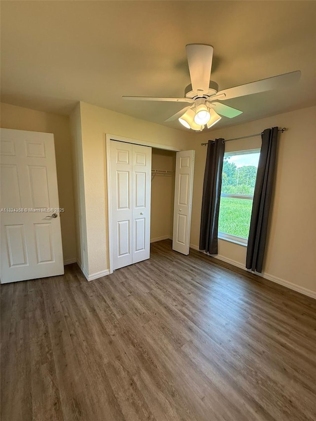 5029 N Dogwood Cir, La Belle, FL 33935 - unfurnished bedroom featuring wood finished floors, a closet, and ceiling fan