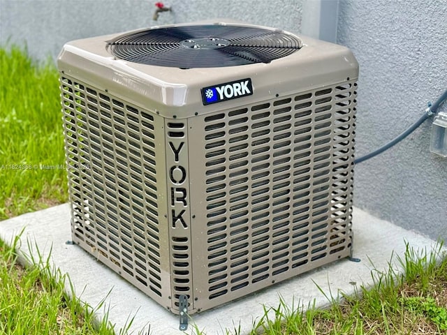 5029 N Dogwood Cir, La Belle, FL 33935 - exterior view of a central AC unit and stucco siding