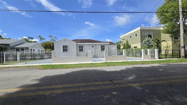 3640 SW 13th St, Miami, FL 33145 - view of front of home with stucco siding and a fenced front yard