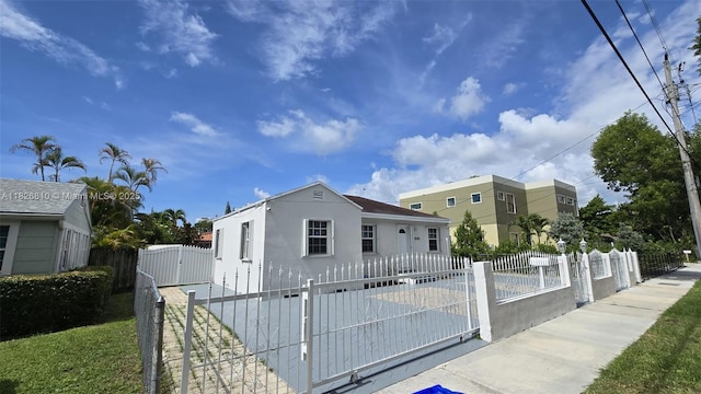 3640 SW 13th St, Miami, FL 33145 - view of front facade featuring a gate, stucco siding, and a fenced front yard