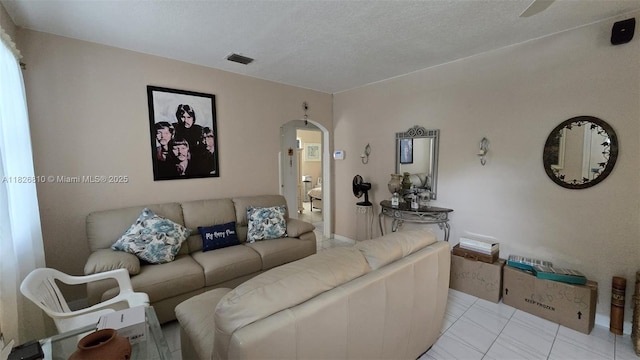 3640 SW 13th St, Miami, FL 33145 - living room with arched walkways and light tile patterned floors