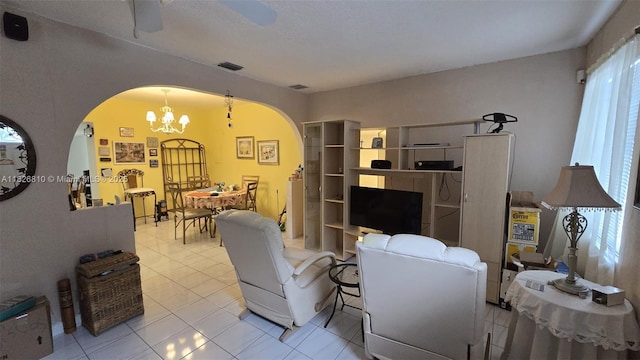 3640 SW 13th St, Miami, FL 33145 - tiled living area with arched walkways, a chandelier, and ceiling fan