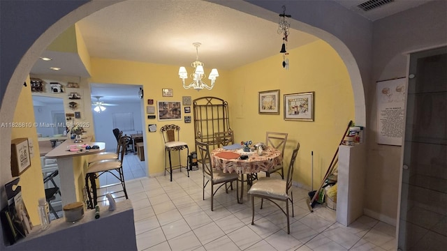 3640 SW 13th St, Miami, FL 33145 - dining room with ceiling fan, arched walkways, a chandelier, and light tile patterned floors