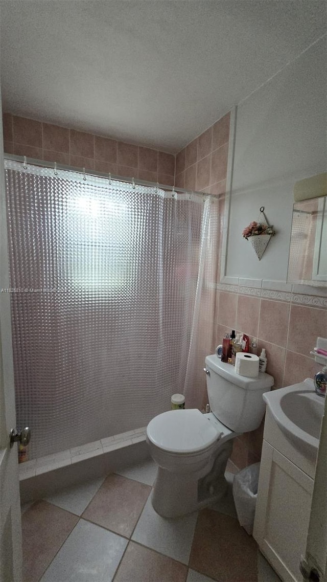 3640 SW 13th St, Miami, FL 33145 - full bathroom with vanity, a tile shower, and tile walls