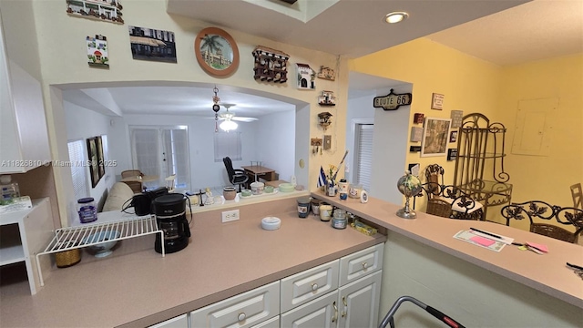 3640 SW 13th St, Miami, FL 33145 - kitchen with arched walkways, ceiling fan, white cabinets, recessed lighting, and light countertops