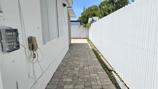 3640 SW 13th St, Miami, FL 33145 - view of side of home featuring a fenced backyard, a patio area, and stucco siding