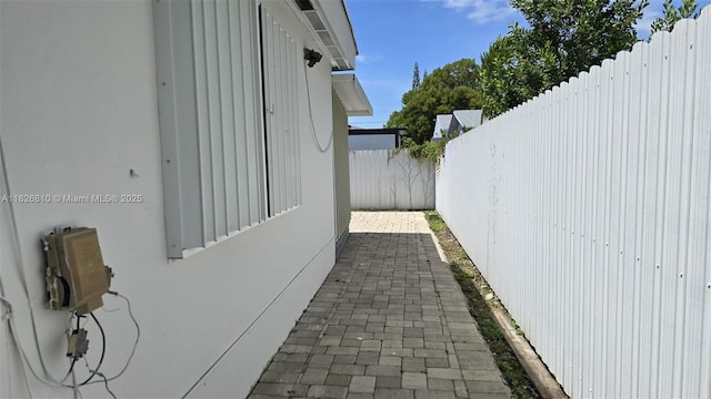 3640 SW 13th St, Miami, FL 33145 - view of property exterior with a fenced backyard, stucco siding, and a patio
