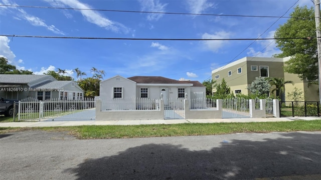 3640 SW 13th St, Miami, FL 33145 - view of front of property featuring stucco siding, a gate, and a fenced front yard