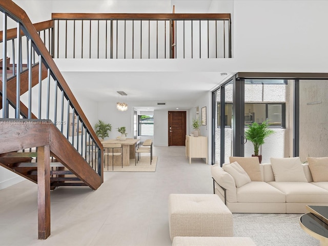 8075 SW 86th Ter, Miami, FL 33143 - living room featuring stairs
