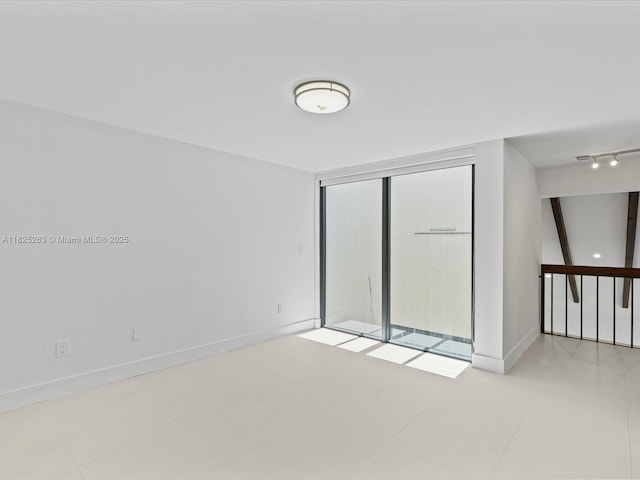 8075 SW 86th Ter, Miami, FL 33143 - empty room featuring baseboards