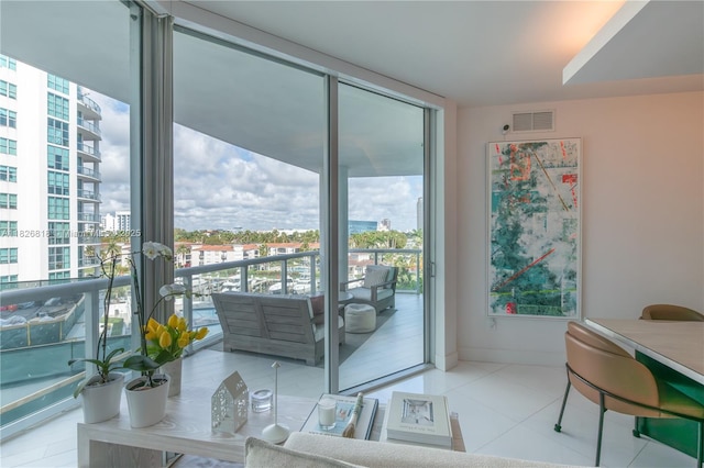 3131 NE 188th St Unit 2-605, Aventura, FL 33180 - doorway to outside with plenty of natural light, expansive windows, a view of city, and tile patterned floors