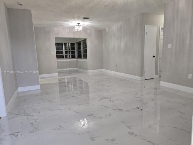 7600 Simms St, Hollywood, FL 33024 - spare room with light marble finish floors, a textured ceiling, and a chandelier