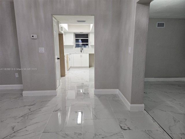 7600 Simms St, Hollywood, FL 33024 - corridor with a sink and light marble finish flooring