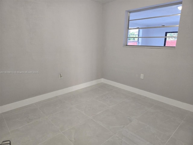 7600 Simms St, Hollywood, FL 33024 - empty room with baseboards and tile patterned floors