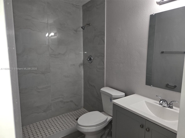 7600 Simms St, Hollywood, FL 33024 - bathroom featuring a tile shower, vanity, and a textured wall