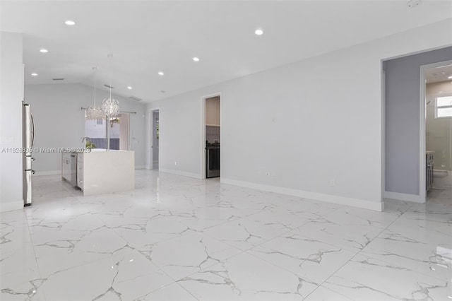 525 El Prado, West Palm Beach, FL 33405 - unfurnished living room with recessed lighting, a chandelier, lofted ceiling, light marble finish flooring, and beverage cooler