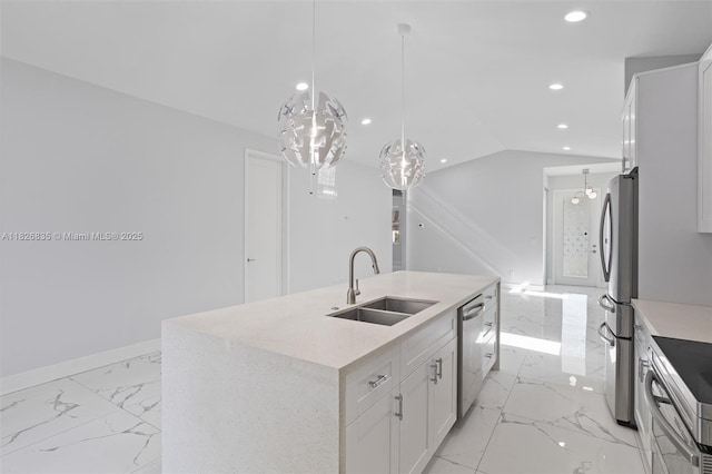 525 El Prado, West Palm Beach, FL 33405 - kitchen with light marble finish flooring, appliances with stainless steel finishes, recessed lighting, white cabinets, and a kitchen island with sink