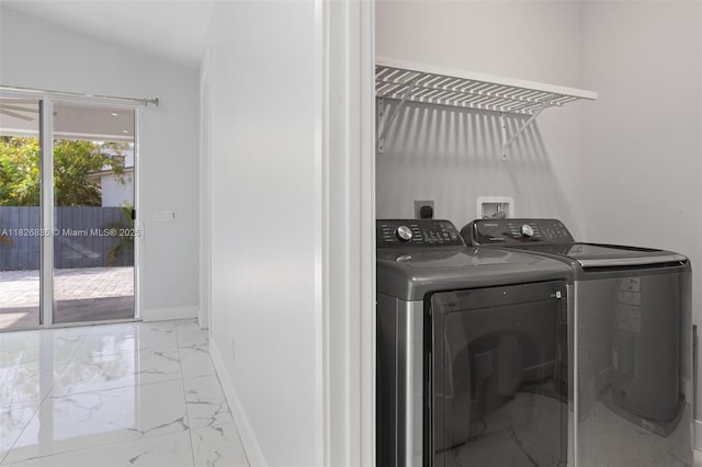 525 El Prado, West Palm Beach, FL 33405 - laundry room with light marble finish floors and separate washer and dryer