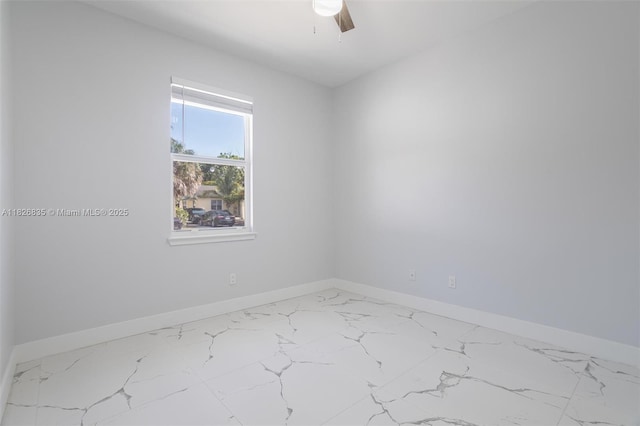 525 El Prado, West Palm Beach, FL 33405 - empty room with marble look tile flooring and ceiling fan
