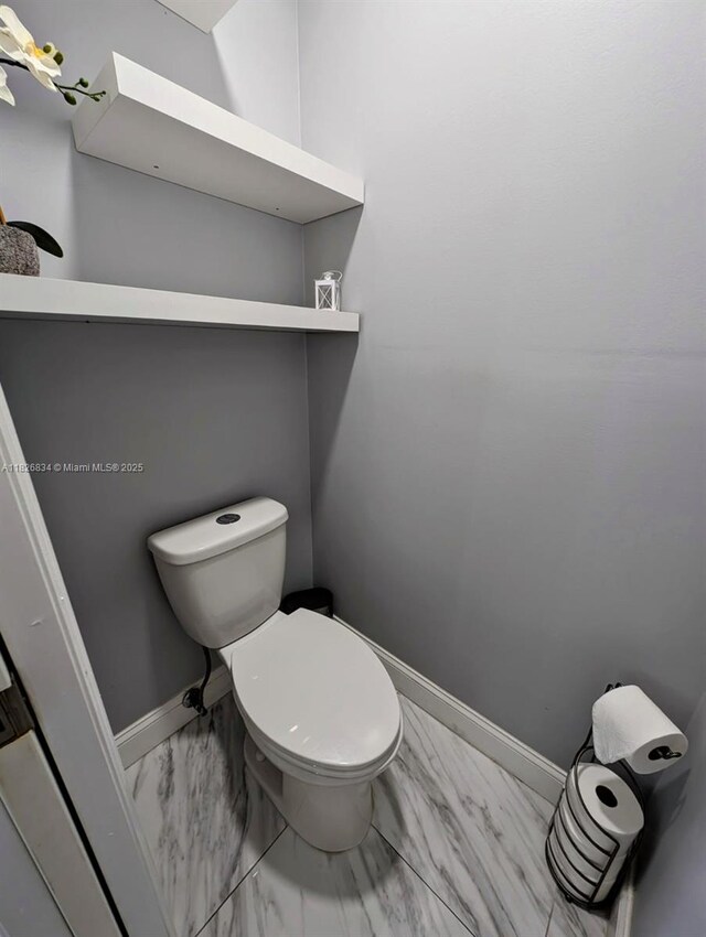 335 SW 183rd Way, Pembroke Pines, FL 33029 - bathroom with marble look tile flooring and toilet