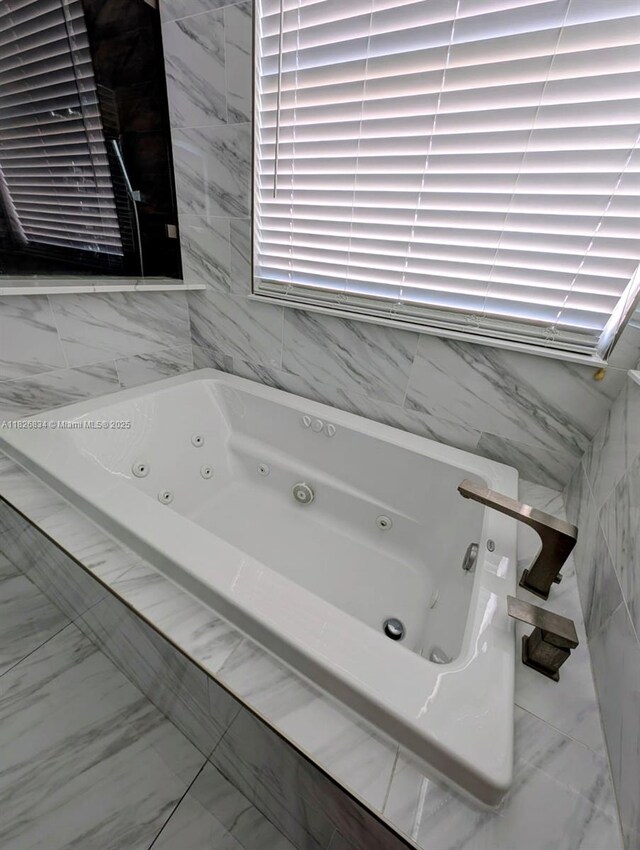 335 SW 183rd Way, Pembroke Pines, FL 33029 - full bathroom with a whirlpool tub and marble look tile flooring
