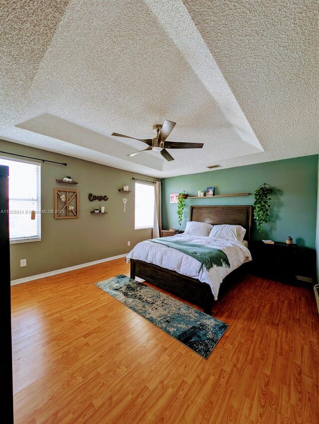 335 SW 183rd Way, Pembroke Pines, FL 33029 - bedroom with a textured ceiling, wood finished floors, and a ceiling fan