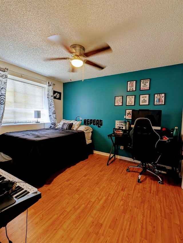 335 SW 183rd Way, Pembroke Pines, FL 33029 - bedroom featuring wood finished floors, a textured ceiling, an office area, and ceiling fan