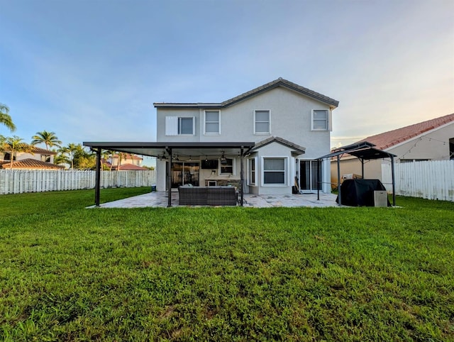 335 SW 183rd Way, Pembroke Pines, FL 33029 - rear view of property featuring a patio, a fenced backyard, a gazebo, and stucco siding