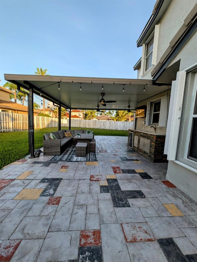335 SW 183rd Way, Pembroke Pines, FL 33029 - fenced backyard featuring an outdoor hangout area, an outdoor kitchen, a patio, and ceiling fan