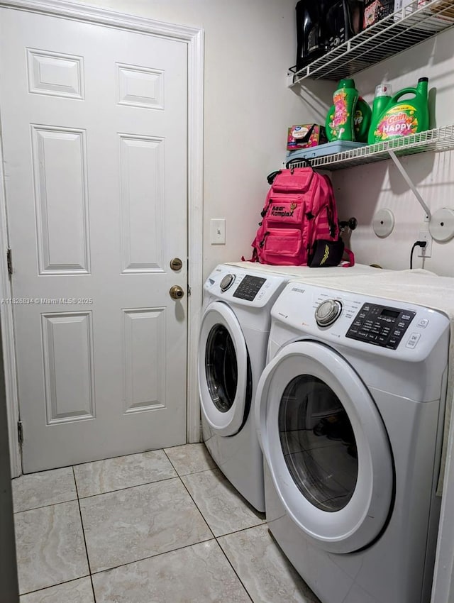 335 SW 183rd Way, Pembroke Pines, FL 33029 - washroom featuring washer and clothes dryer and light tile patterned flooring