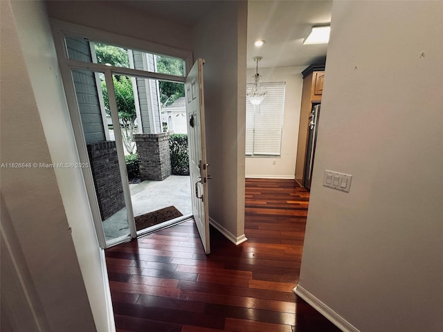 3125 Stonewater Dr Lakeland Fl, Lakeland Fl, FL 33803 - foyer entrance featuring dark wood-style floors and a chandelier
