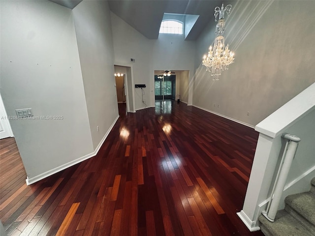 3125 Stonewater Dr Lakeland Fl, Lakeland Fl, FL 33803 - hall with stairs, wood-type flooring, a chandelier, and a high ceiling