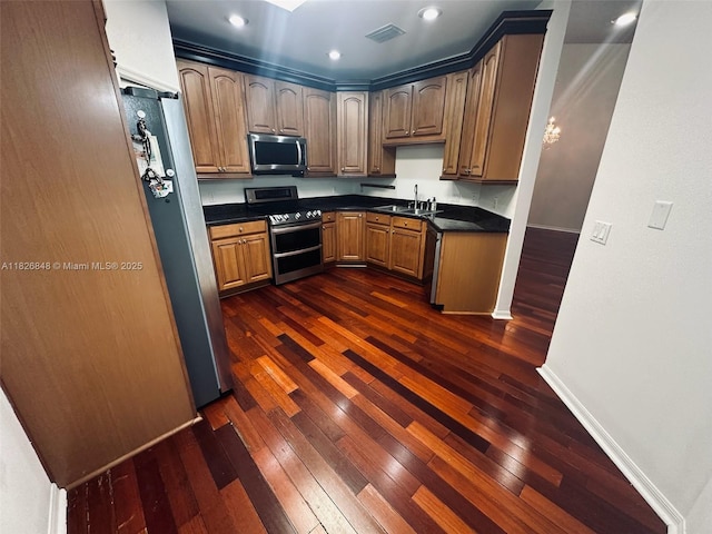 3125 Stonewater Dr Lakeland Fl, Lakeland Fl, FL 33803 - kitchen featuring stainless steel appliances, dark countertops, dark wood-style floors, and recessed lighting