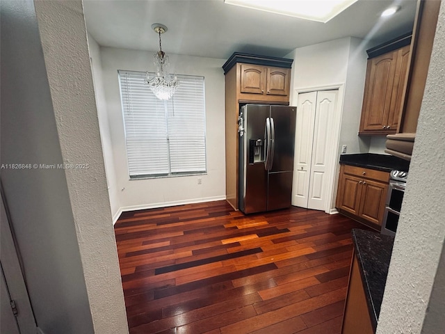 3125 Stonewater Dr Lakeland Fl, Lakeland Fl, FL 33803 - kitchen with appliances with stainless steel finishes, dark wood-type flooring, dark countertops, and hanging light fixtures