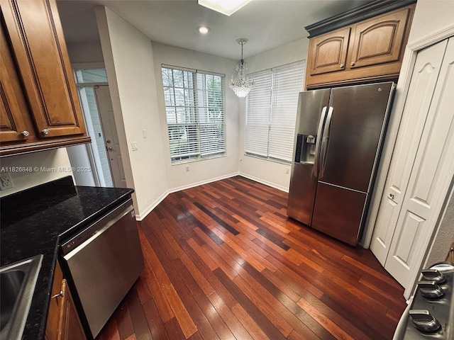 3125 Stonewater Dr Lakeland Fl, Lakeland Fl, FL 33803 - kitchen featuring appliances with stainless steel finishes, a chandelier, dark wood-style flooring, dark stone counters, and recessed lighting