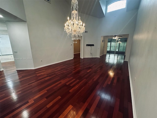 3125 Stonewater Dr Lakeland Fl, Lakeland Fl, FL 33803 - unfurnished living room with a high ceiling, wood-type flooring, a chandelier, a skylight, and a ceiling fan