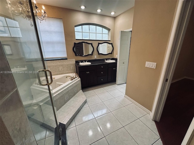 3125 Stonewater Dr Lakeland Fl, Lakeland Fl, FL 33803 - bathroom with double vanity, a bath, a stall shower, a chandelier, and tile patterned flooring