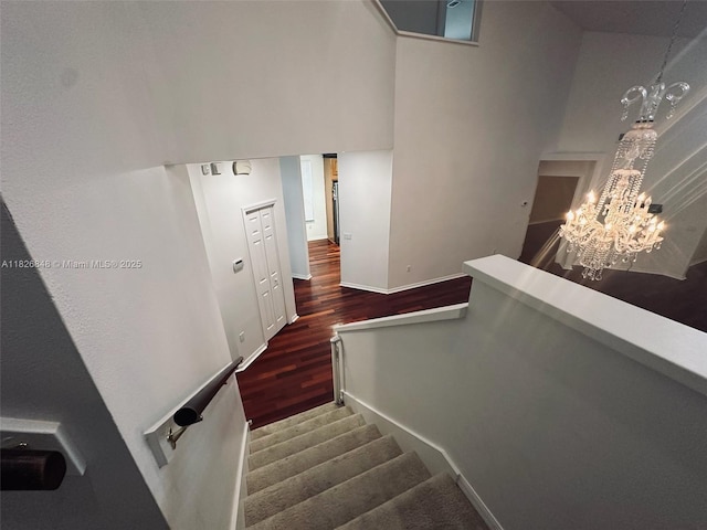3125 Stonewater Dr Lakeland Fl, Lakeland Fl, FL 33803 - stairway with wood finished floors and a chandelier