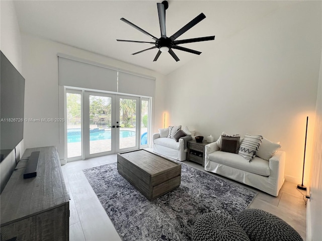 1732 SW 103rd Ln, Davie, FL 33324 - living area featuring french doors, ceiling fan, vaulted ceiling, and tile patterned flooring