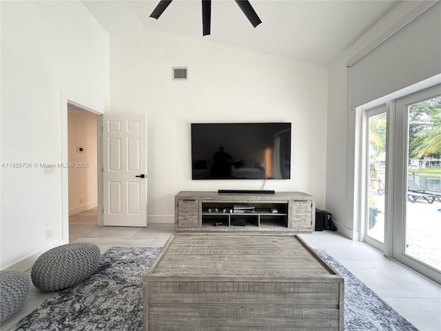 1732 SW 103rd Ln, Davie, FL 33324 - living area featuring ceiling fan, tile patterned floors, and vaulted ceiling