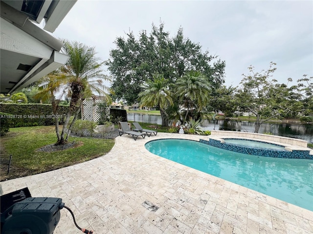 1732 SW 103rd Ln, Davie, FL 33324 - view of pool featuring a water view, a patio, a fenced backyard, and a pool with connected hot tub