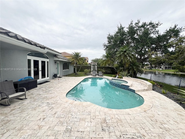 1732 SW 103rd Ln, Davie, FL 33324 - view of swimming pool featuring french doors, a patio, a fenced backyard, and a pool with connected hot tub