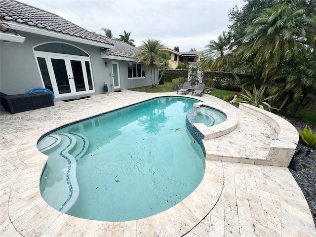 1732 SW 103rd Ln, Davie, FL 33324 - view of swimming pool with french doors, a patio, and a pool with connected hot tub
