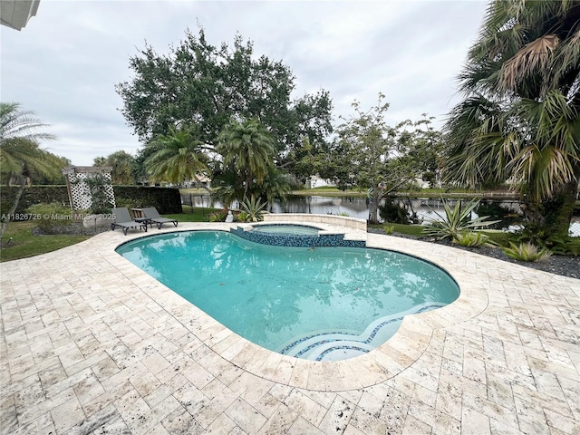 1732 SW 103rd Ln, Davie, FL 33324 - view of swimming pool featuring a water view, a patio area, and a pool with connected hot tub
